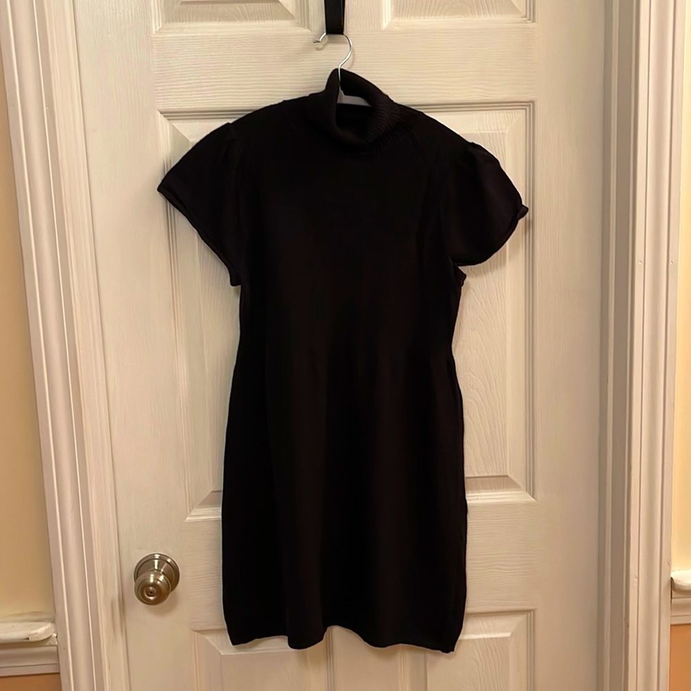Black Calvin Klein short sleeved short sweater dress. Size M